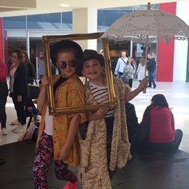 Frankie and Zizi at the Style Evolution selfie station in vintange clothes.jpg thumbnail